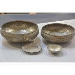 An Eastern plated hammered and engraved bowl and another similar, an Eastern white metal swing