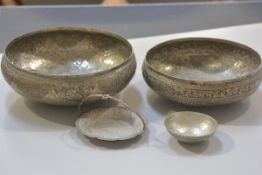 An Eastern plated hammered and engraved bowl and another similar, an Eastern white metal swing