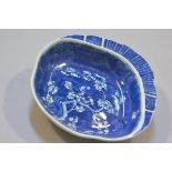 A 19thc Chinese porcelain shell shaped serving dish with prunus underglaze blue design (h. 4.5cm