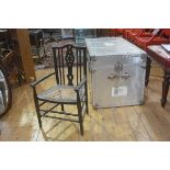 An Edwardian Arts & Crafts style child's spindle back cane seat open armchair, on turned supports (