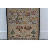 A Victorian sampler by Jessie Ann Anderson aged 12, dated 1885, with alphabet and numbers with