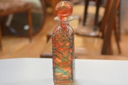 A Michael Harris Mdina glass decanter with orange overlaid design (h. 31cm)