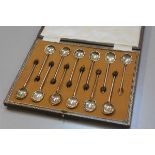 A set of twelve silver bean handled coffee spoons (one bean terminal missing), Sheffield 1945 (96g)