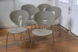 A set of six Stua Globus moulded dining chairs on anodised metal supports, by Jesus Gasca model