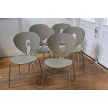 A set of six Stua Globus moulded dining chairs on anodised metal supports, by Jesus Gasca model