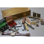 A rectangular brass three section cigarette box, a collection of various novelty pen knives, a