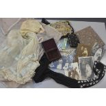 A 1920s child's silk net and lace dress and bonnet complete with rose embroidered voile pyjama case,