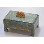 An unusual 1930s bakelite green faux lacquered cigarette box with bracket style feet in the