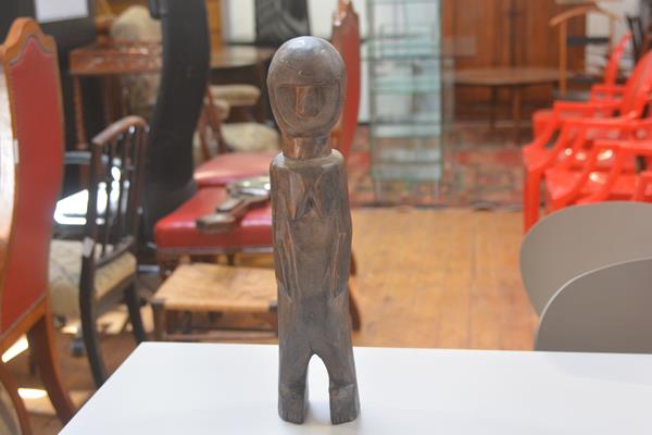 An Ethiopian carved fertility figure of a Woman Standing (h. 50cm)