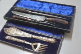 A pair of Edwardian Epns engraved fish servers complete with fitted case and an Edwardian stag's