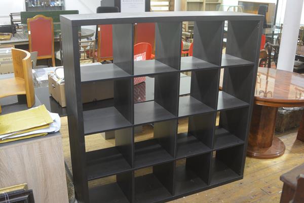 An Ikea black ash cube storage unit, fitted four sections (h. 147cm x l. 107cm x d. 39cm)