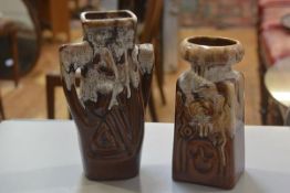 Two German style 1970s/80s pottery moulded vases with brown and white slip glaze (tallest: 31cm x