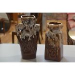 Two German style 1970s/80s pottery moulded vases with brown and white slip glaze (tallest: 31cm x