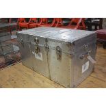 A post war American aluminium travel trunk with studded top, fitted blue lined tray and interior,