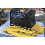 A vintage Shilton International black leather gentleman's holdall complete with cloth bag