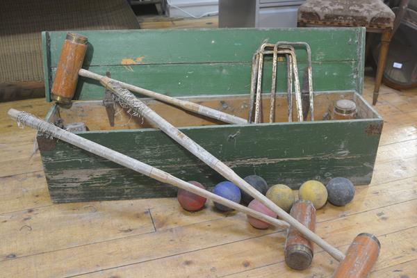 A green painted Jacques style pine croquet box with rope handles to side containing an assortment of