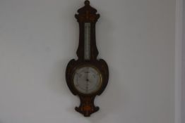 An Edwardian rosewood inlaid banjo style barometer in the Adam style with harebell and urn inlays in