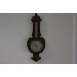 An Edwardian rosewood inlaid banjo style barometer in the Adam style with harebell and urn inlays in