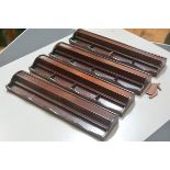 A set of four Chinese cherrywood Mahjong brick holders (two with losses) (h. 4cm x l. 40cm x d.