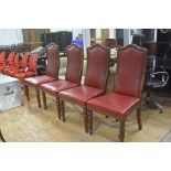 A set of four 19thc mahogany upholstered arched panel back dining chairs with studded detail, in red