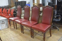 A set of four 19thc mahogany upholstered arched panel back dining chairs with studded detail, in red