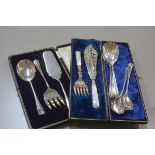 A set of three Epns serve alls in fitted case, a pair of Edwardian mother of pearl handled Epns
