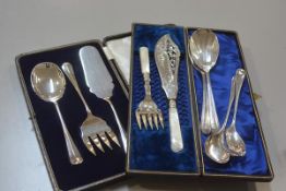 A set of three Epns serve alls in fitted case, a pair of Edwardian mother of pearl handled Epns