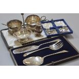 A mixed lot comprising a set of three Edwardian engraved fish servers complete with original box, an