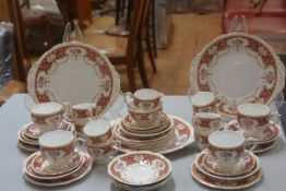 A Queen Anne Regency pattern forty piece tea and coffee service complete with three cake plates,