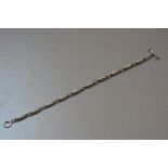 A Georg Jensen Danish silver barrel and loop pattern bracelet with T bar closure (l. approx 20cm) (