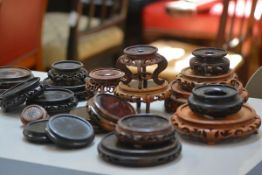 Four pairs of carved hardwood and teak vase stands and a collection of thirteen other various vase