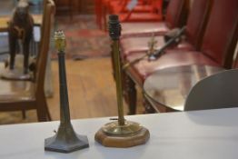 A plated octagonal column table lamp, c.1920 and a brass circular column table lamp on treen base (