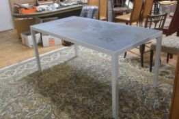 A tubular aluminium frame satin finish rectangular reversible glass topped kitchen/dining table or