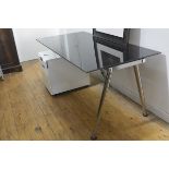 An Ikea black toughened glass rectangular adjustable office desk complete with laminated two