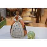 A Spanish terracotta figure in National style costume (h.30cm), a Mdina glass paperweight (2)