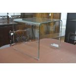 A Habitat toughened glass arched occasional table on chrome tips (h. 41cm x 45cm x 45cm)