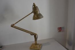 A 1930s/40s anodised metal adjustable anglepoise lamp with painted marbled finish, raised on stepped