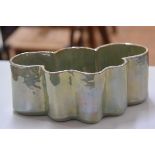 Margery Clinton (1931 - 2005), an earthenware green lustre freeform bowl, c. 1970. (h. 12cm x