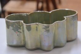 Margery Clinton (1931 - 2005), an earthenware green lustre freeform bowl, c. 1970. (h. 12cm x