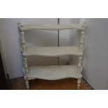 A 19thc French three tier stepped etagere raised on turned supports with distressed cream and