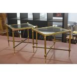 A pair of 1980s brass glazed panel top square lamp tables raised on fluted supports united by