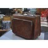 A vintage tan hide folding carry on case with zipper side pockets and handle to top (h. 46cm x l.