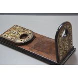 A Victorian burr walnut adjustable bookslide with arched fold down ends, with brass and ivorine