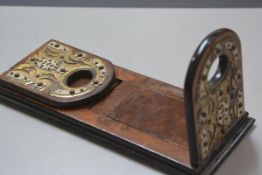 A Victorian burr walnut adjustable bookslide with arched fold down ends, with brass and ivorine