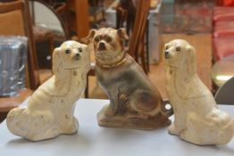 A pair of Staffordshire style chimney spaniels decorated with craquelure glaze and polychrome