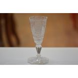 A 19thc German octagonal goblet with engraved crest and motto, on faceted stem and spreading