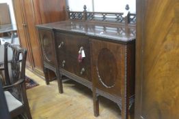 A late 19thc Chippendale design ledgeback sideboard with pierced gallery back, mounted with