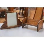 A 1930s mahogany photograph frame with stylised fan shaped twin supports (h.23cm w.37cm) and an