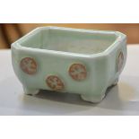 A Celadon ware octagonal bonsai dish decorated with applied brown glazed dragon design, on bracket