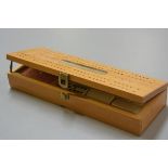 A modern pine gentleman's brass mounted games compendium, complete with dominoes, cribbage board,